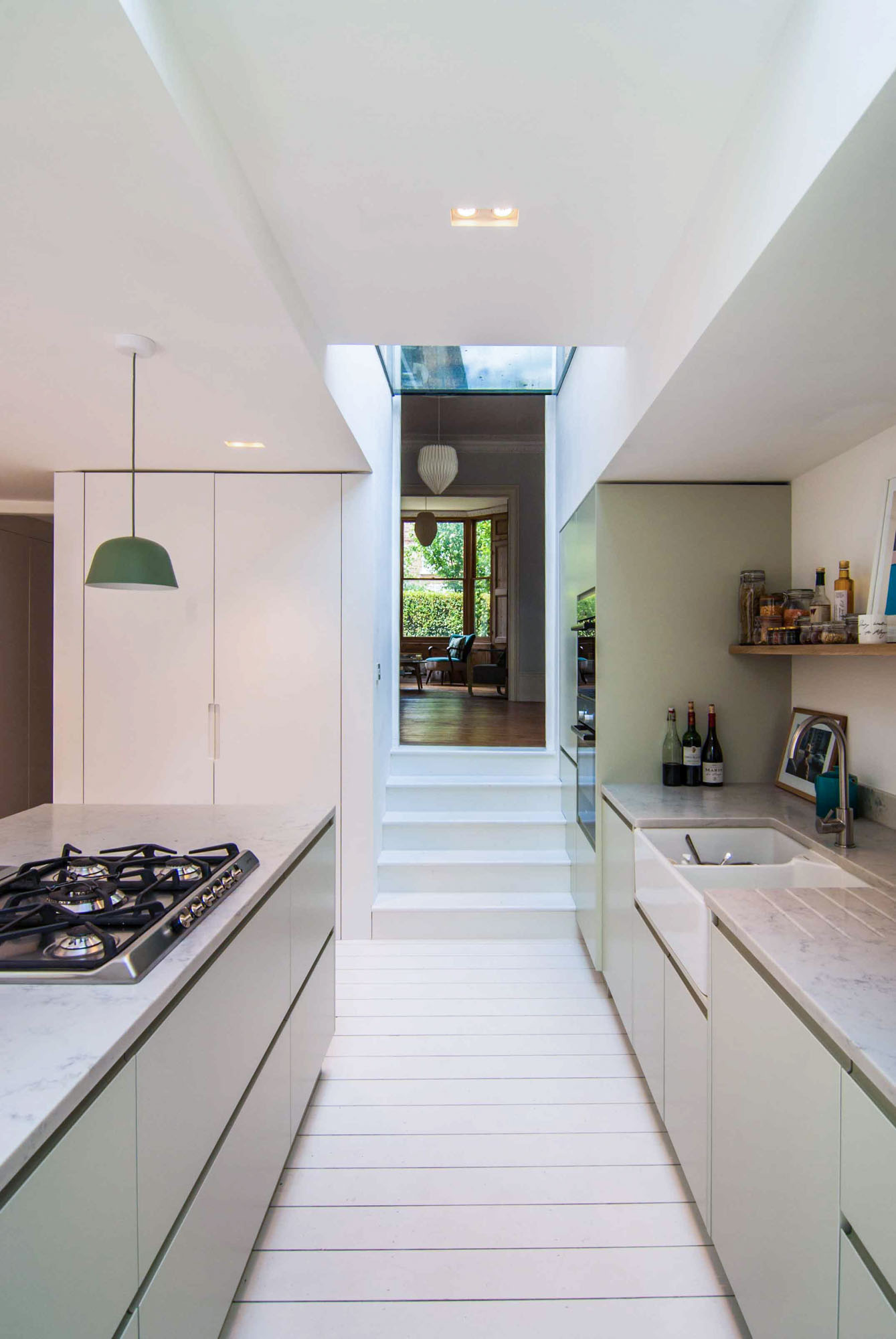 Photographer's House: Contemporary spacious kitchen with a minimalist colour palette.
