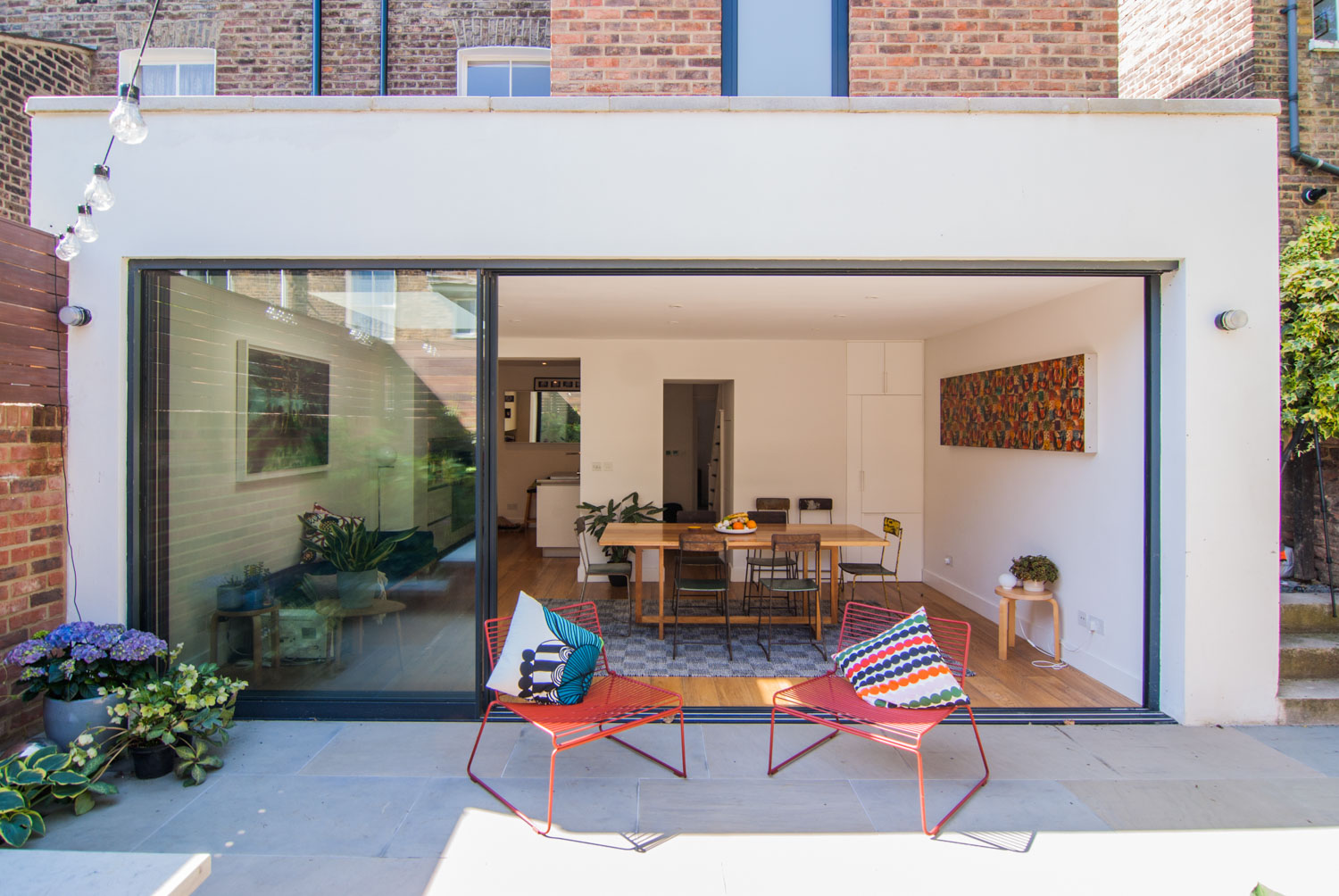 Rear extension including large sliding doors leading to an open and spacious dining area.