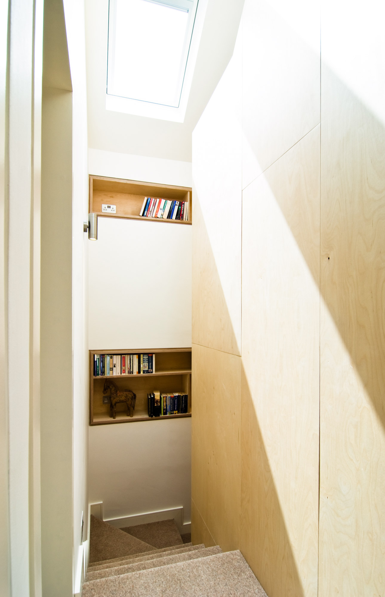 Close up of the plywood shelving by the staircase.