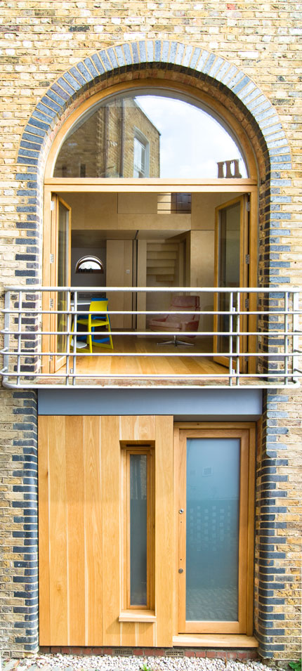 Arched balcony doors overlooking the entrance to the Mews property.