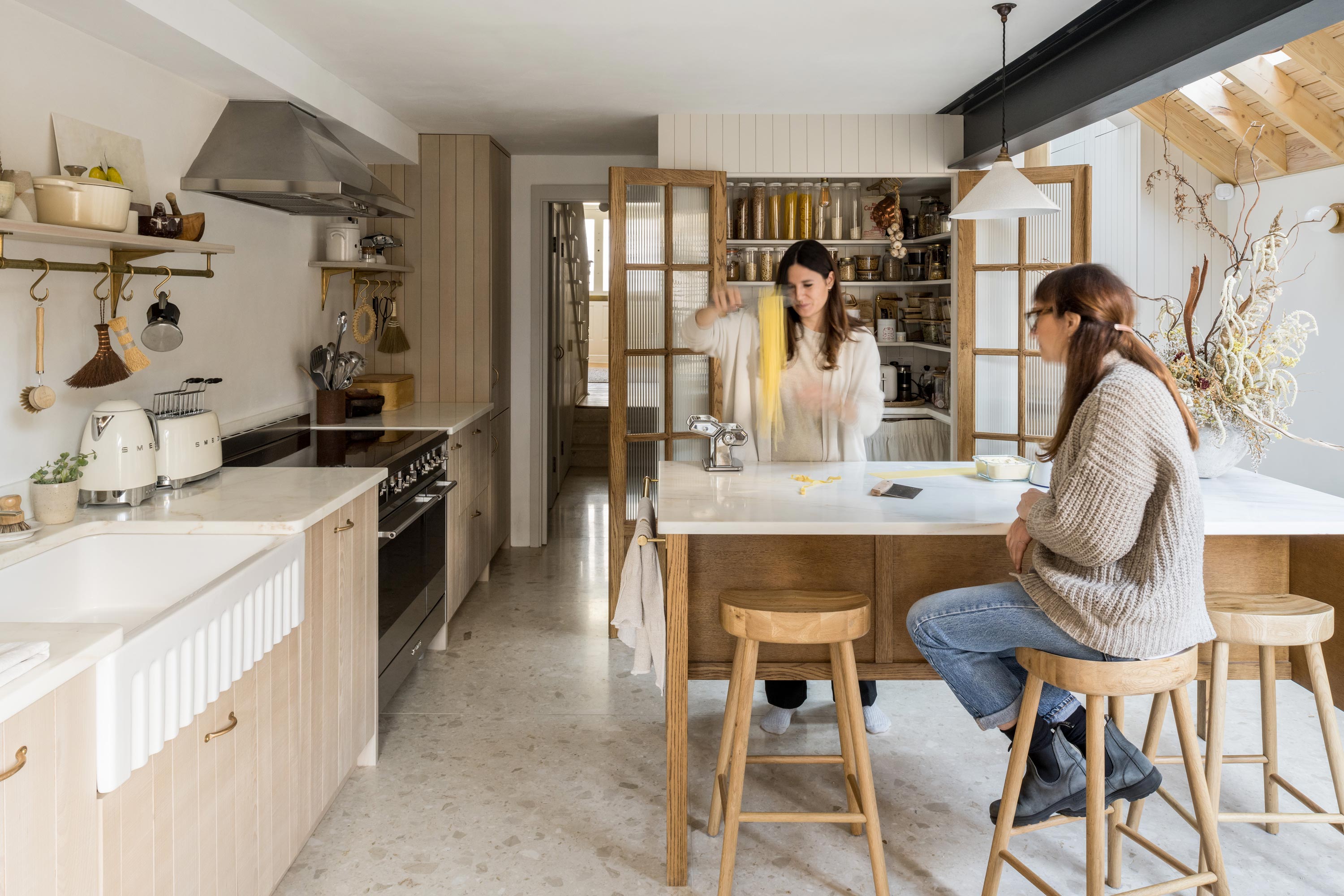 Martina and friend in their kitchen