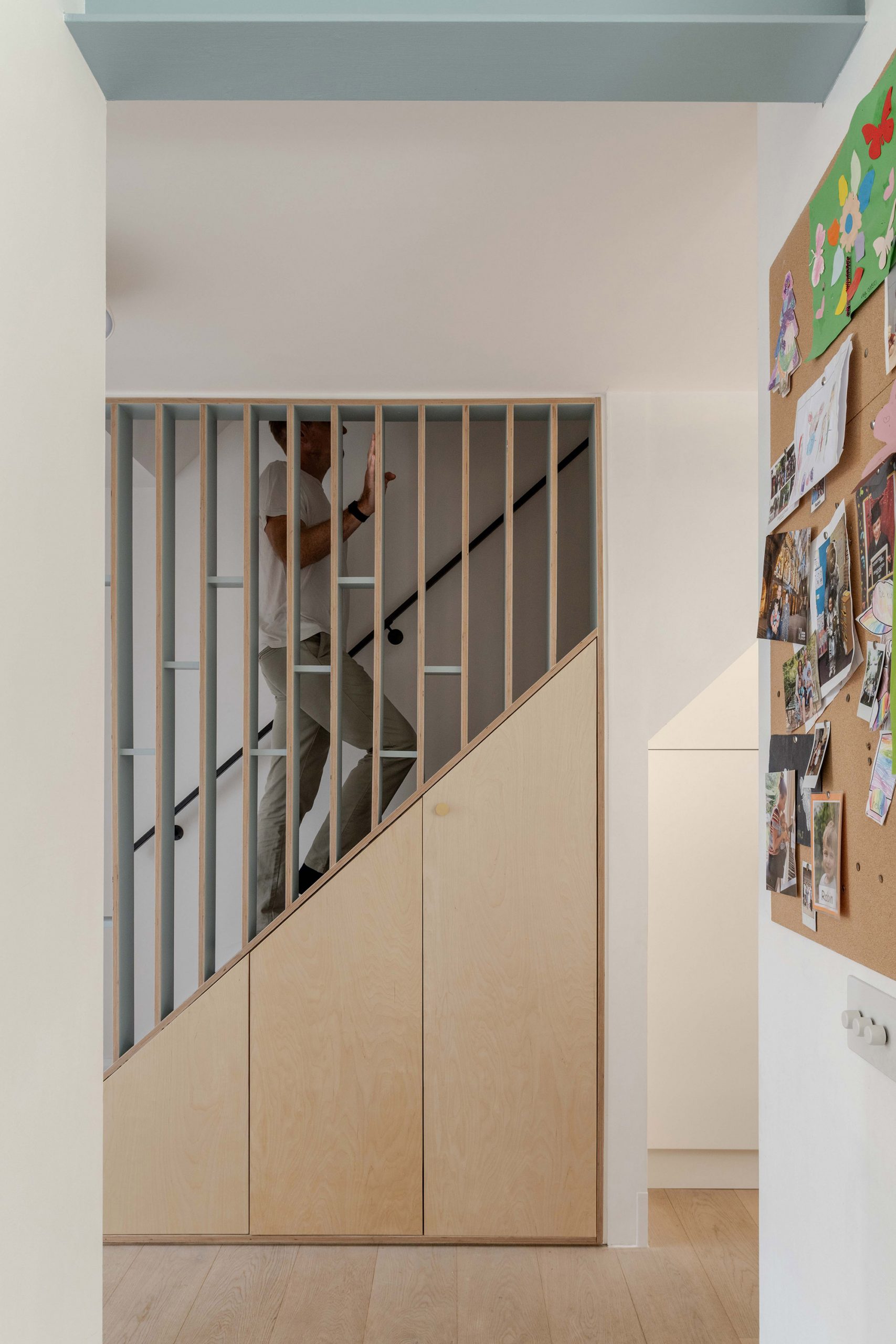 Stair balustrade in plywood and new plywood under stair storage.