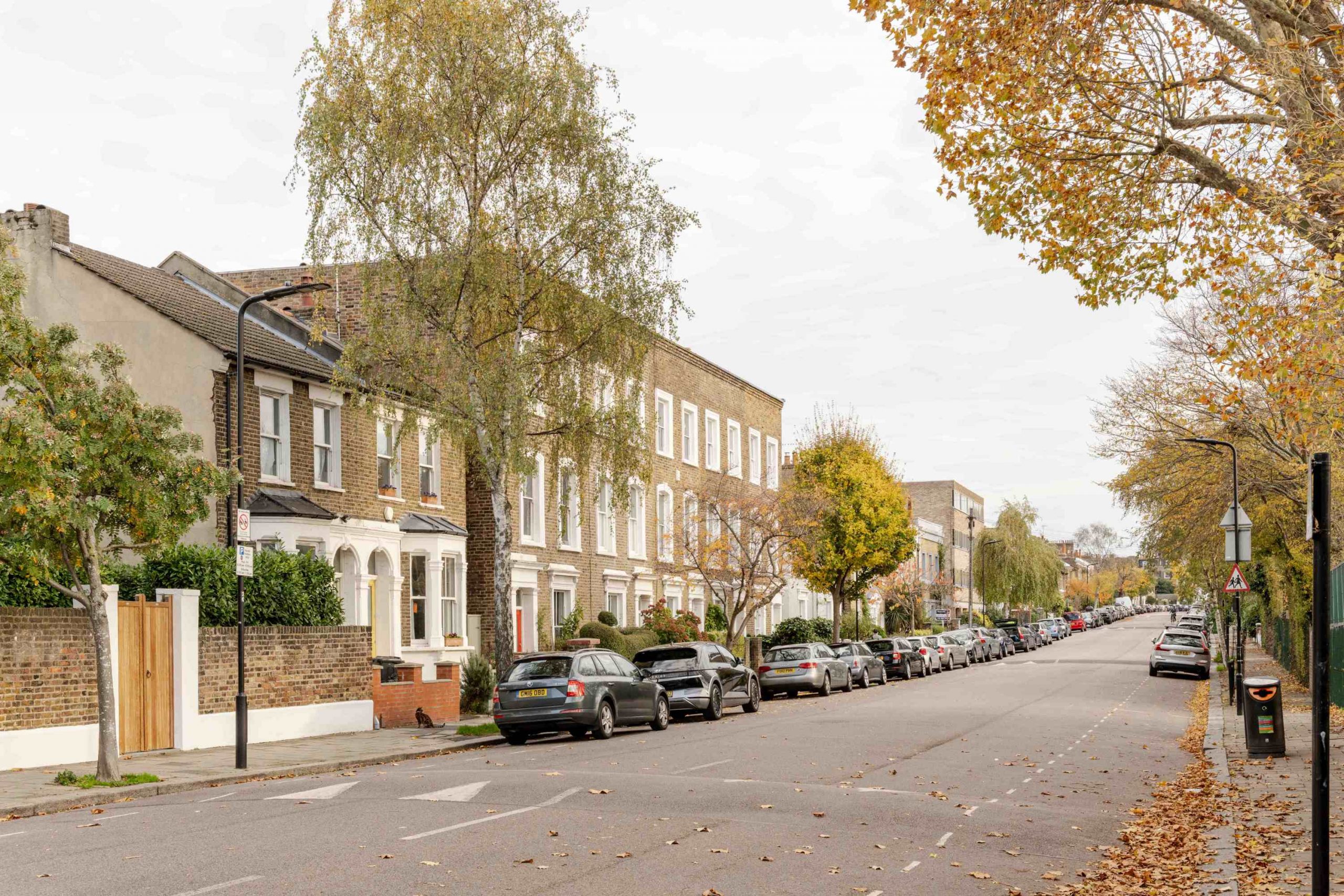 North London family home extension with stepped brick façade and large glazing by Bradley Van Der Straeten Architects.