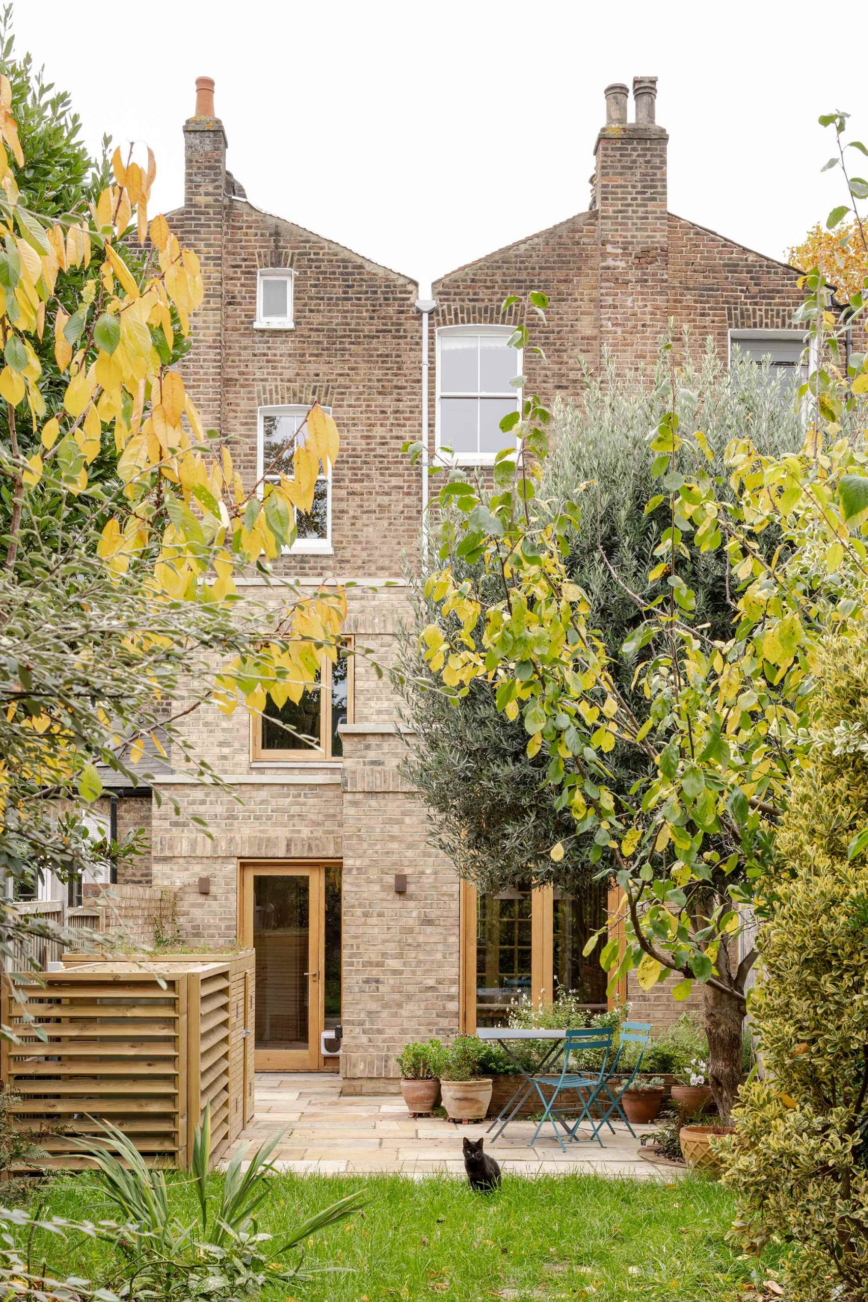 Exterior detail of reclaimed brickwork and timber windows in a Stoke Newington extension designed by Bradley Van Der Straeten Architects.