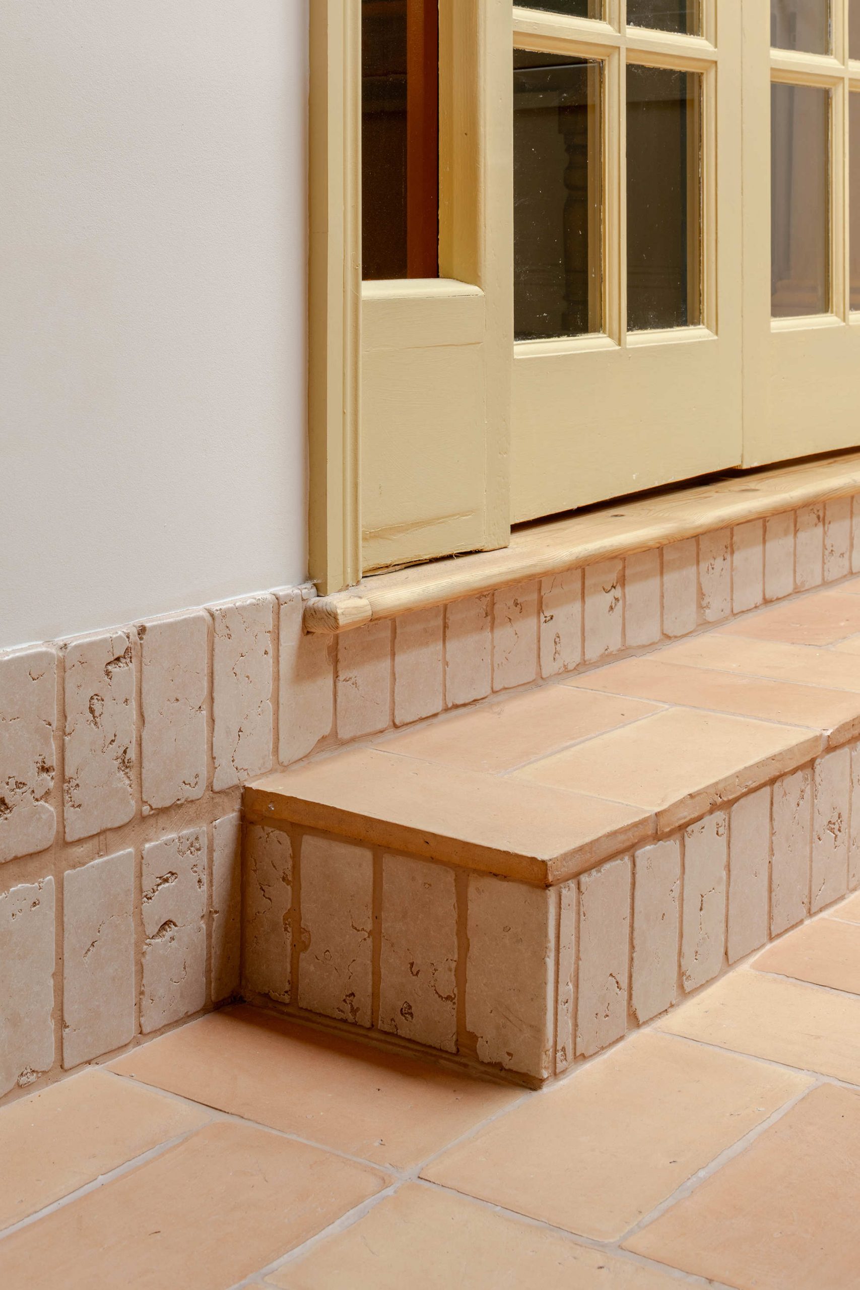 Contemporary kitchen interior in a North London house extension with natural materials and soft colour palette by Bradley Van Der Straeten Architects.