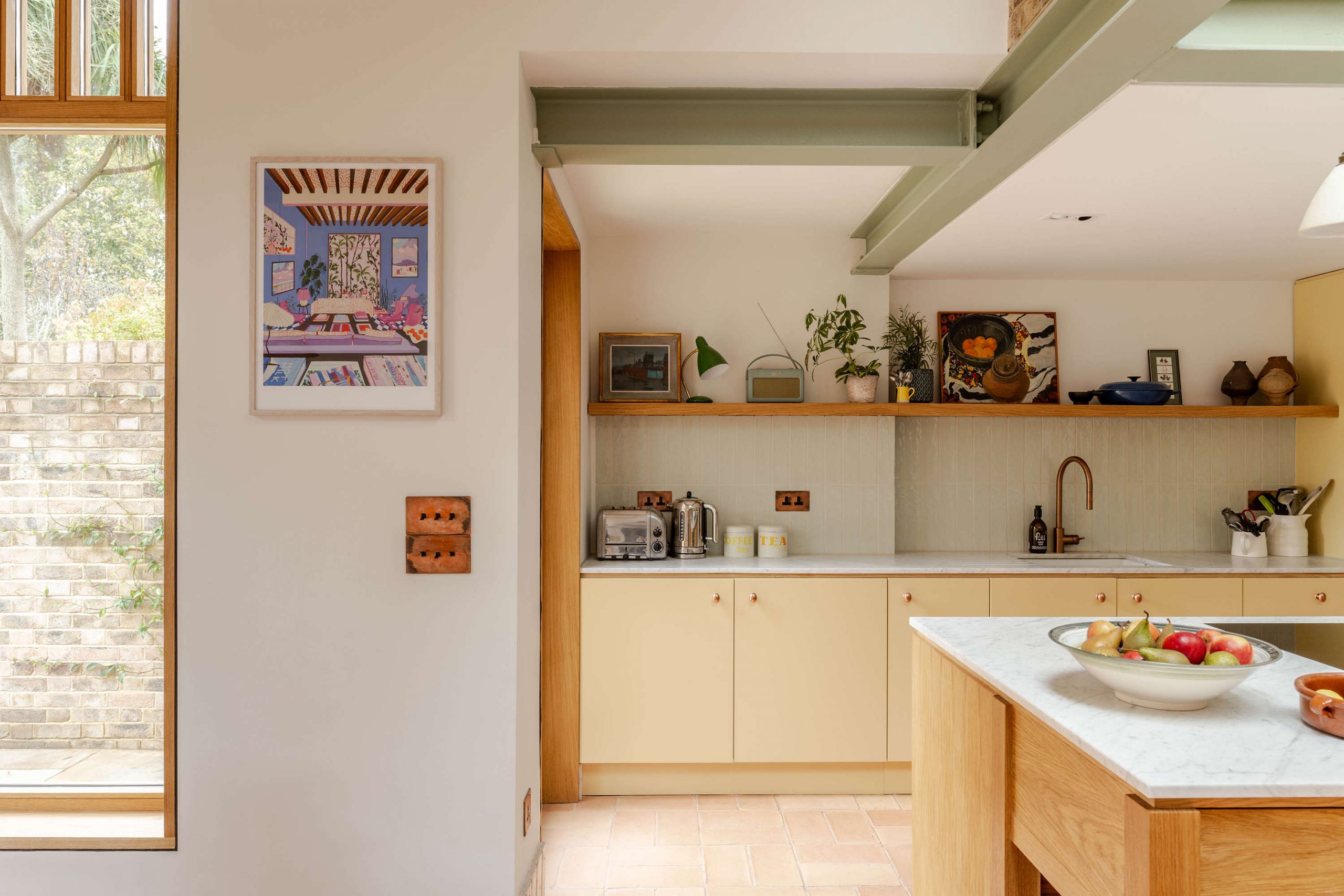 Bespoke kitchen cabinetry and natural material finishes in a North London house renovation by Bradley Van Der Straeten Architects.