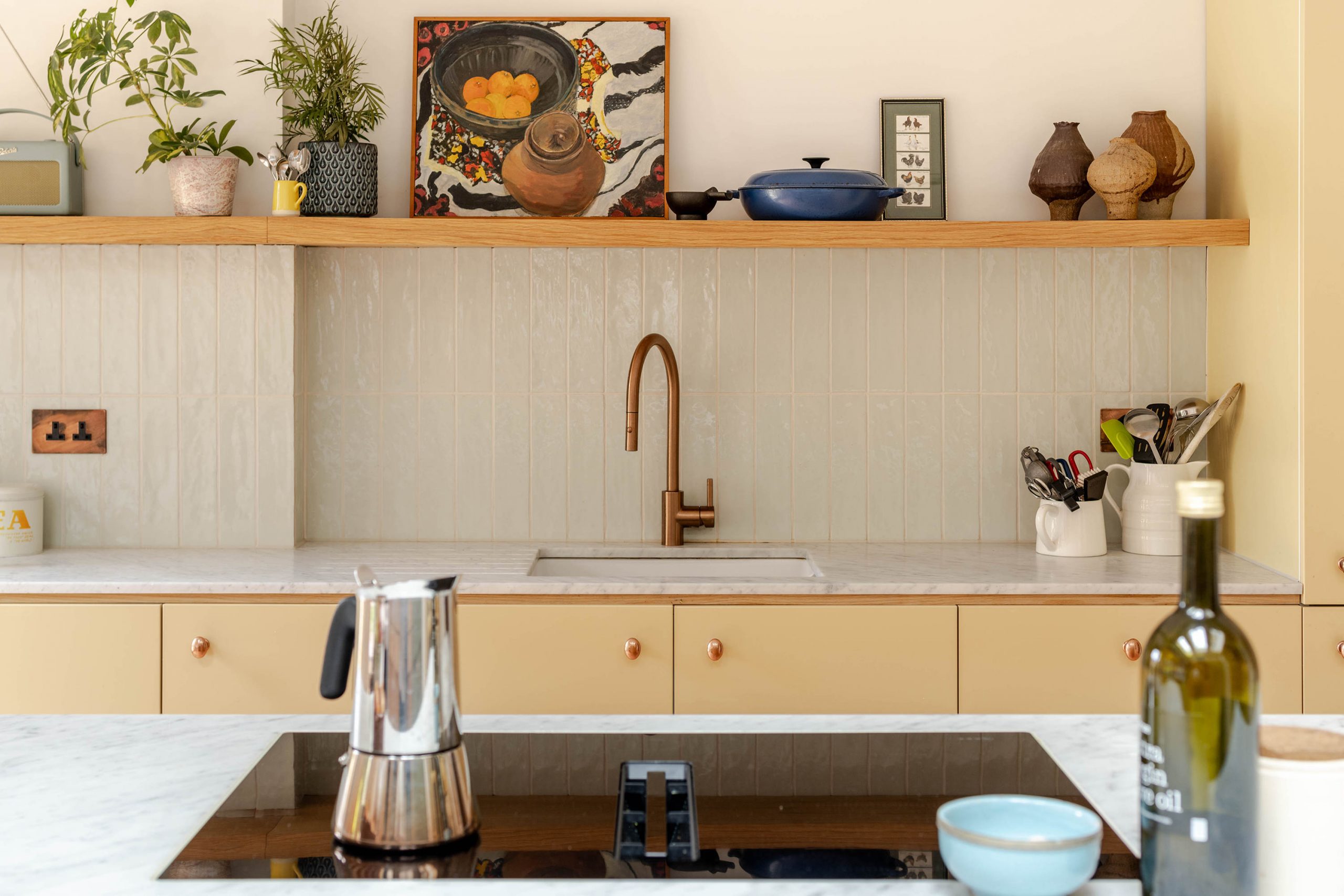 Bespoke kitchen joinery and terracotta tile flooring in a Stoke Newington family home renovation by Bradley Van Der Straeten Architects.
