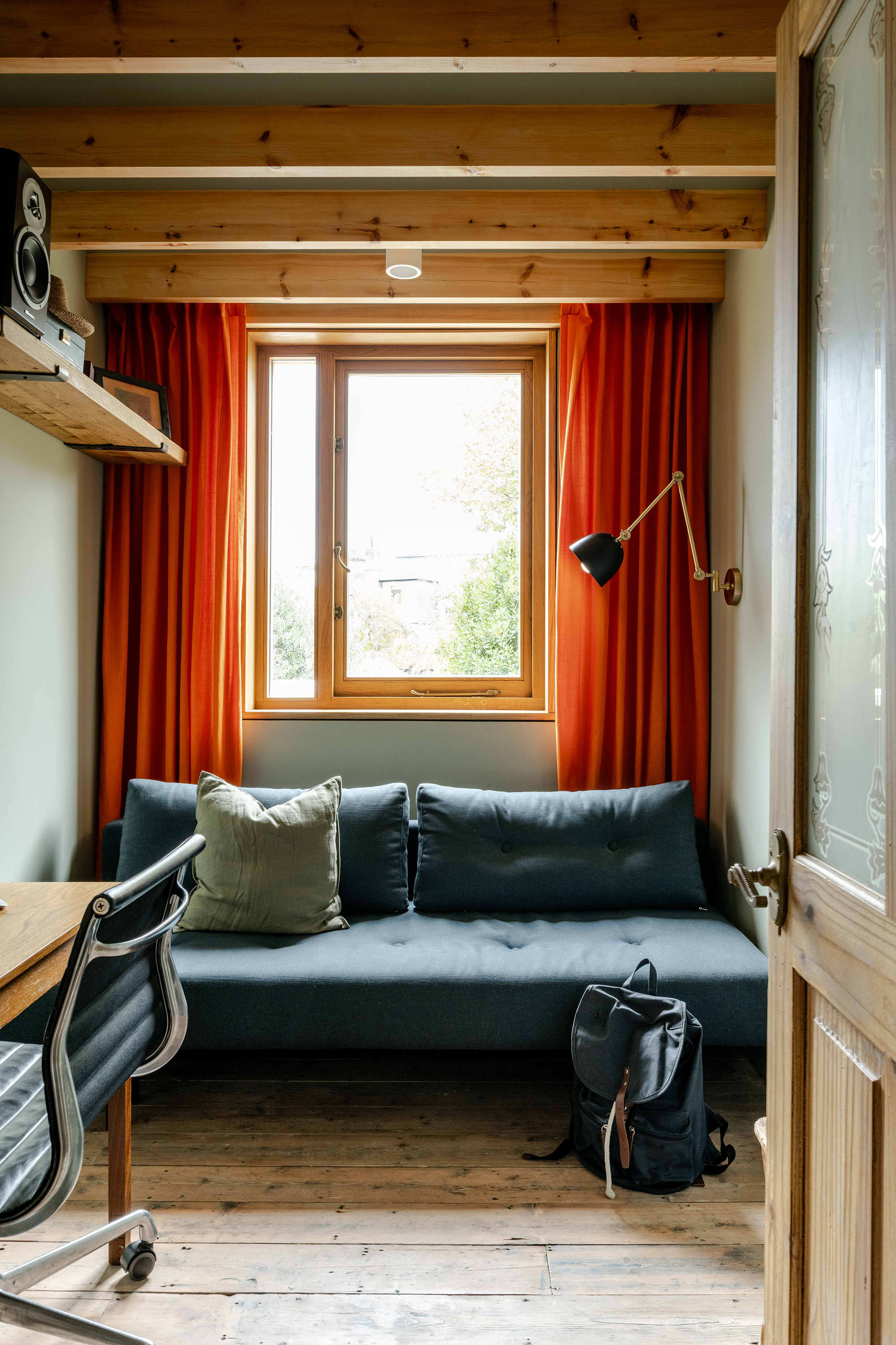 Flexible study and reading space with sofa in a North London family home renovation by Bradley Van Der Straeten Architects.
