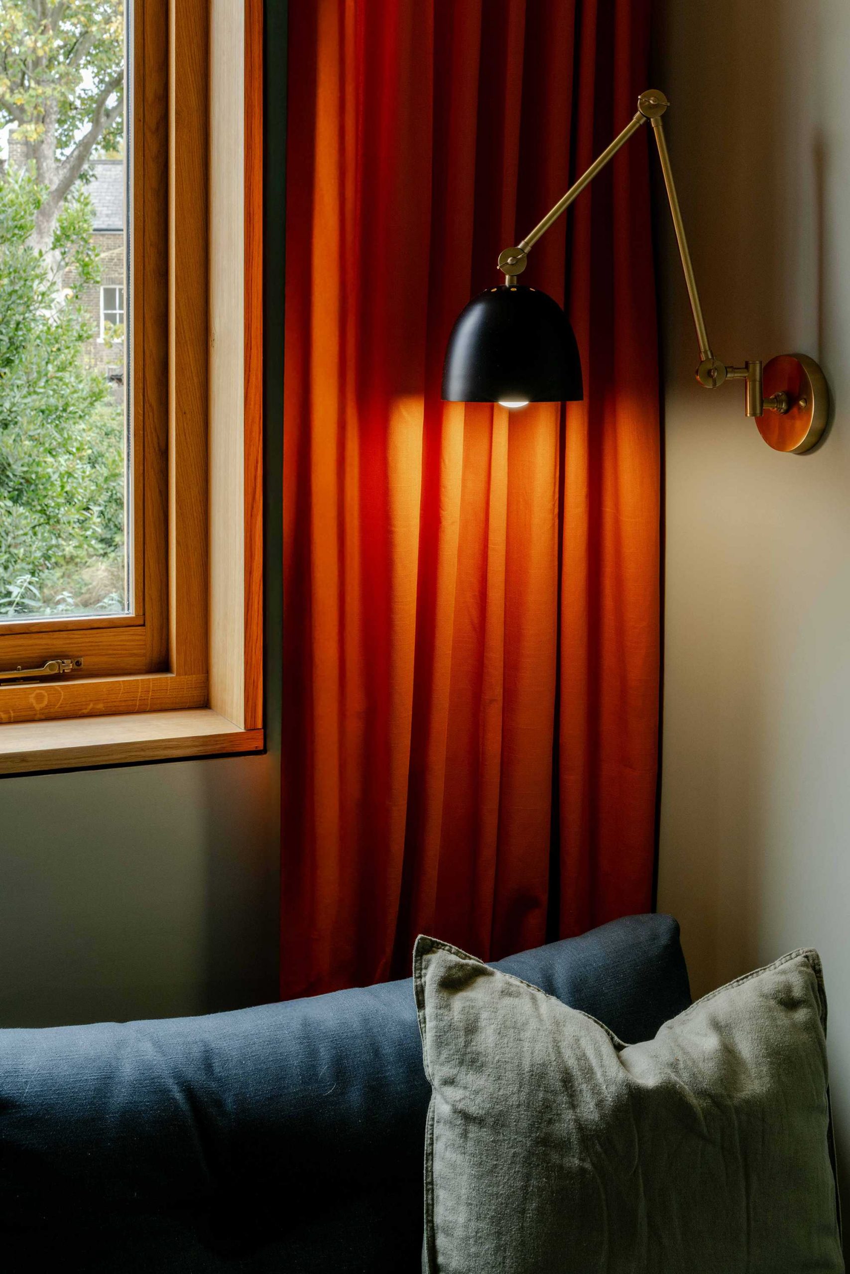 Home study with sofa and warm material palette in a Stoke Newington terrace extension by Bradley Van Der Straeten Architects.